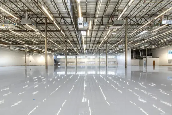 Epoxy-coated floor reflecting overhead lights. Stock photograph.